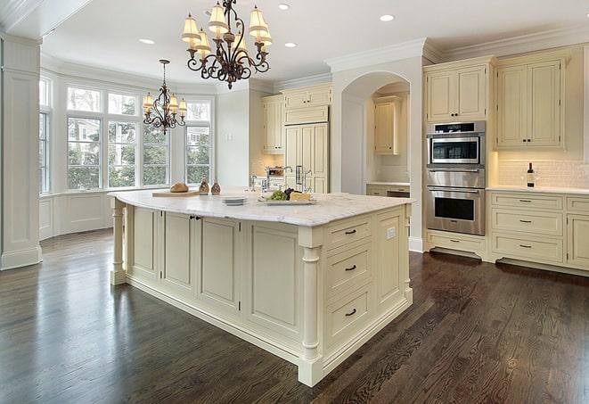 a modern kitchen with newly installed laminate floors in Jamesburg